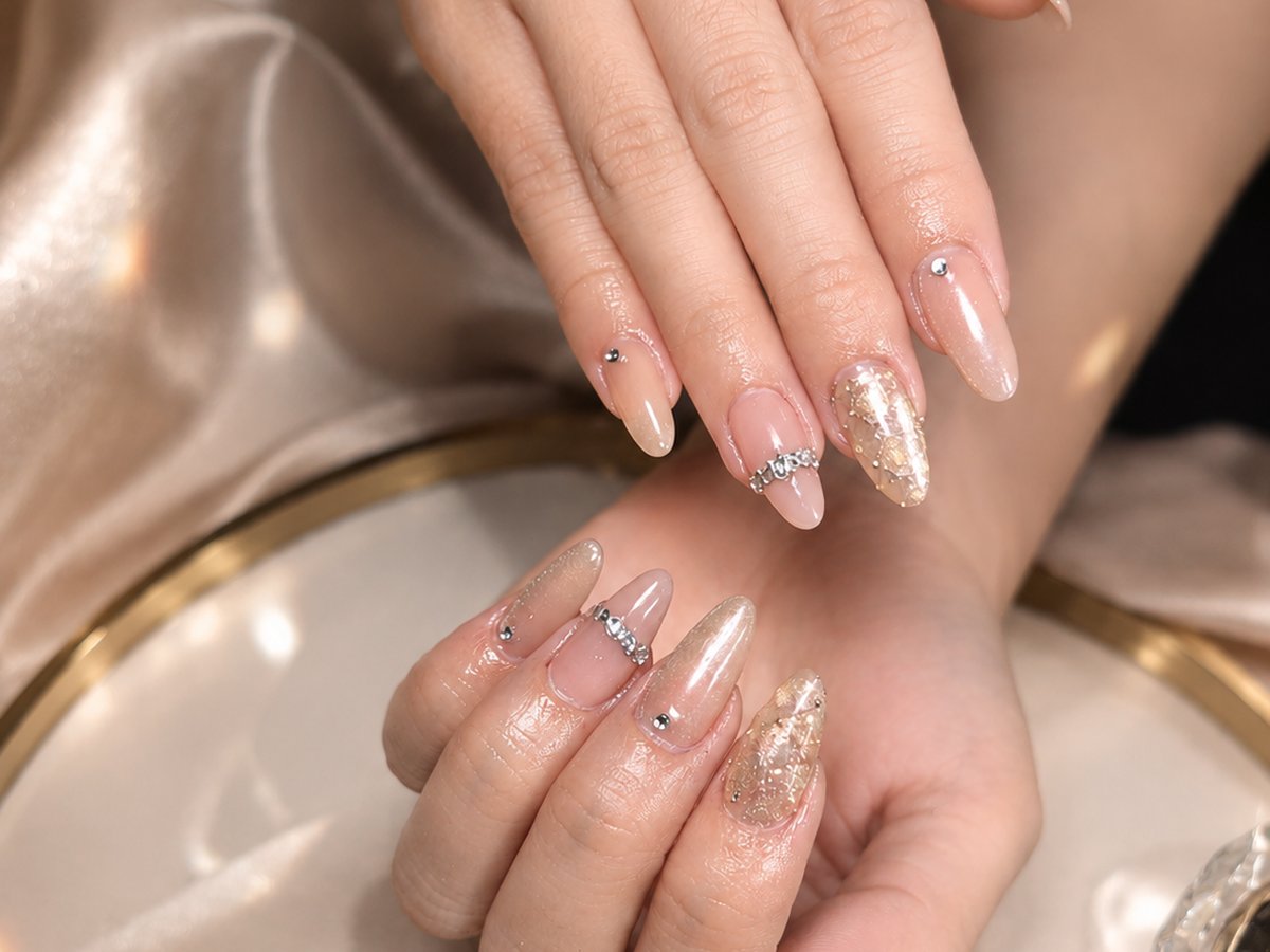 Elegant nude and pearl nails with delicate crystal accents