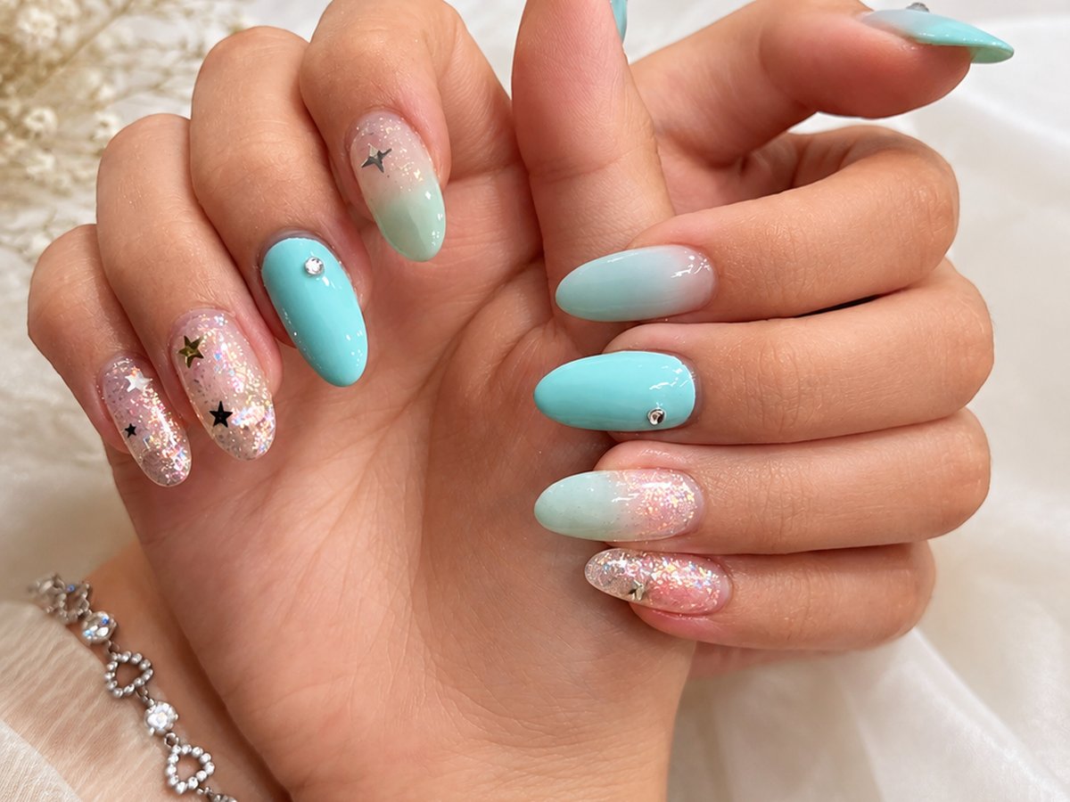Mint blue and glitter ombre nails with star details